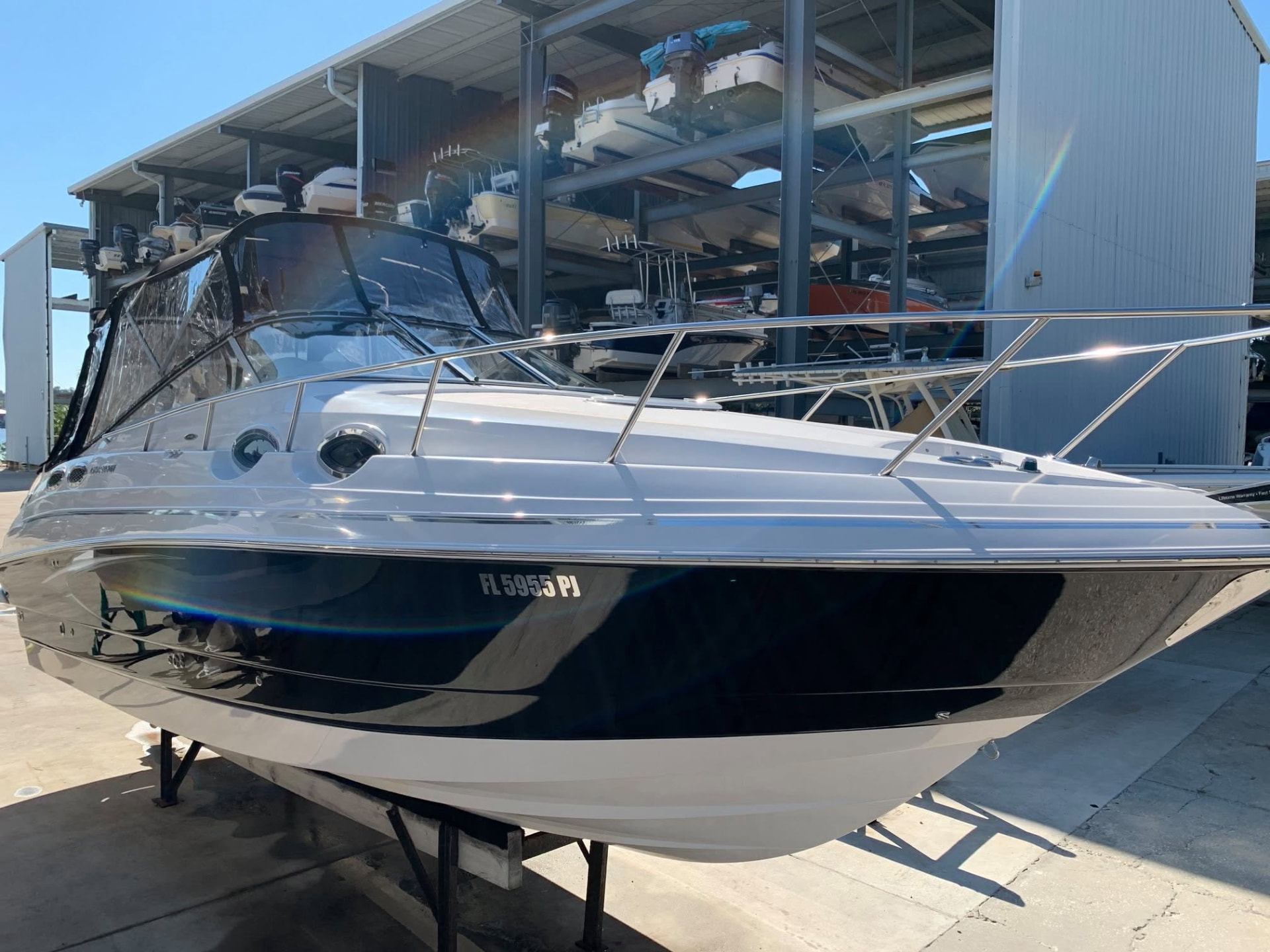 Finished yacht after detailing, freshly polished hull gleaming in the yard