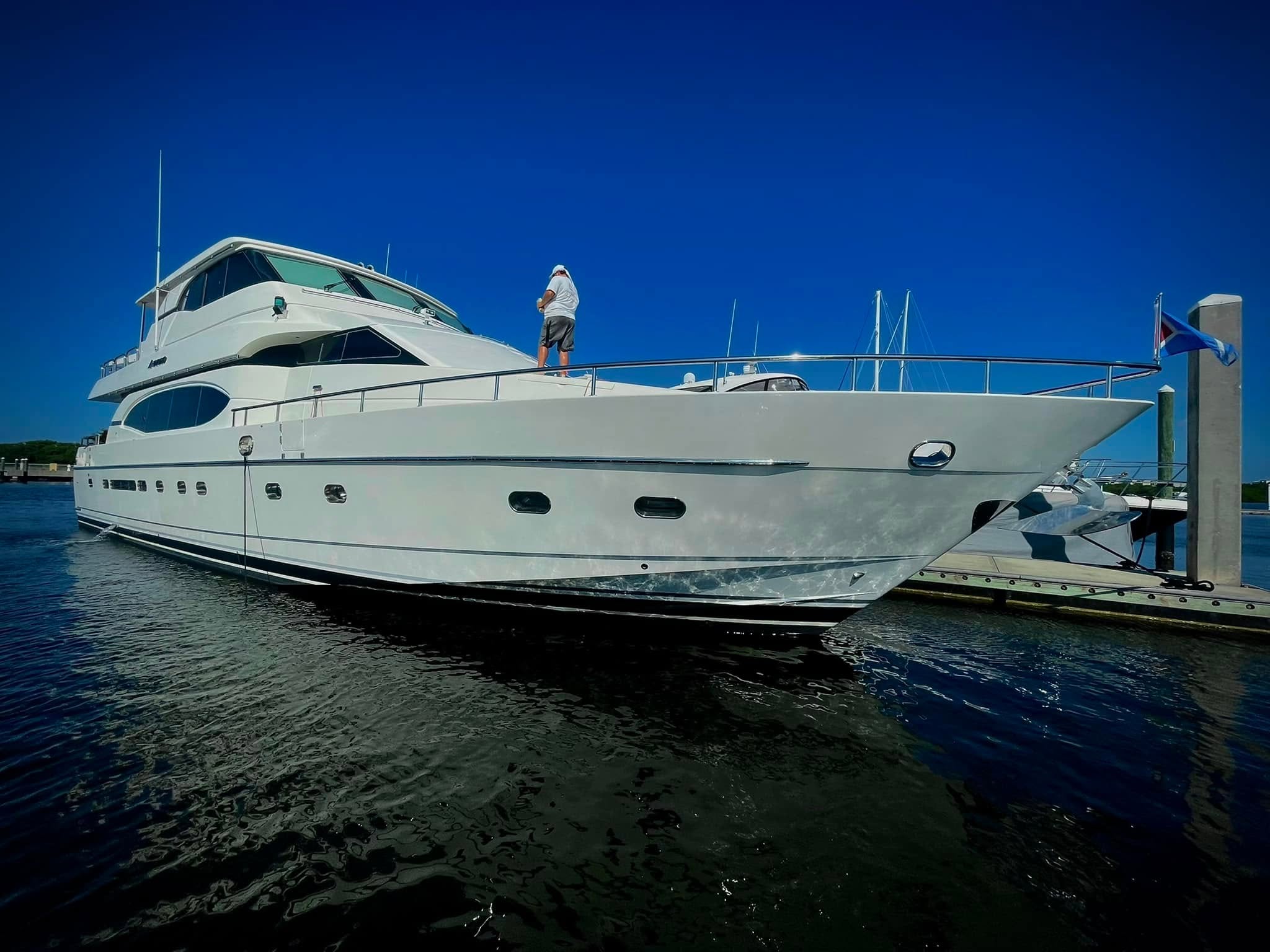 Luxury Boat Detailing crew performing mobile service on a large yacht