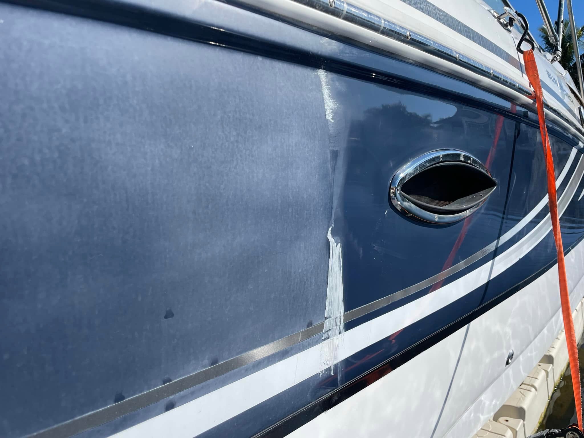 Single boat surface showing the untreated side beside the restored, polished side